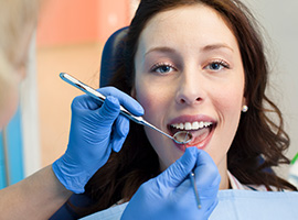 Woman receiving dental services from East Brunswick New Jersey dentist