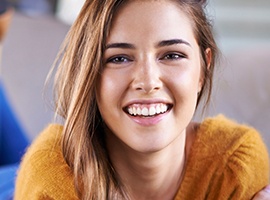 Woman smiling after scaling and root planing gum disease treatment