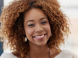 Young woman with flawless smile after veneers